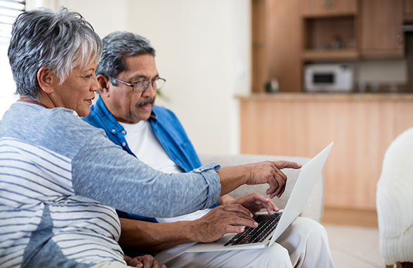 Couple on Laptop_Medicare Enrollment